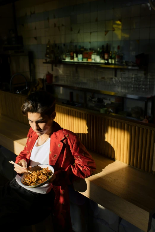 a woman in a red jacket holding a plate of food, a portrait, inspired by Elsa Bleda, pexels contest winner, back light, pasta, boys, diner scene