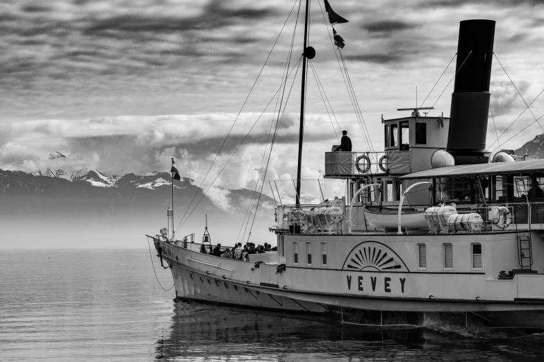 a black and white photo of a boat in the water, a black and white photo, by Cedric Peyravernay, pixabay contest winner, art nouveau, glacier, steamboat willy, vibrant setting, valeriy vegera