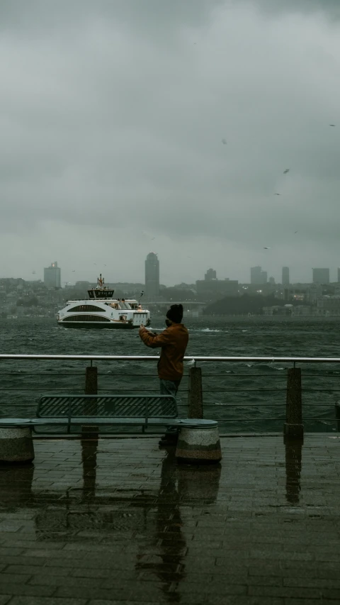 a man standing on top of a bench next to a body of water, by irakli nadar, pexels contest winner, hurufiyya, a ship lost in a storm, watching new york, a person standing in front of a, waving