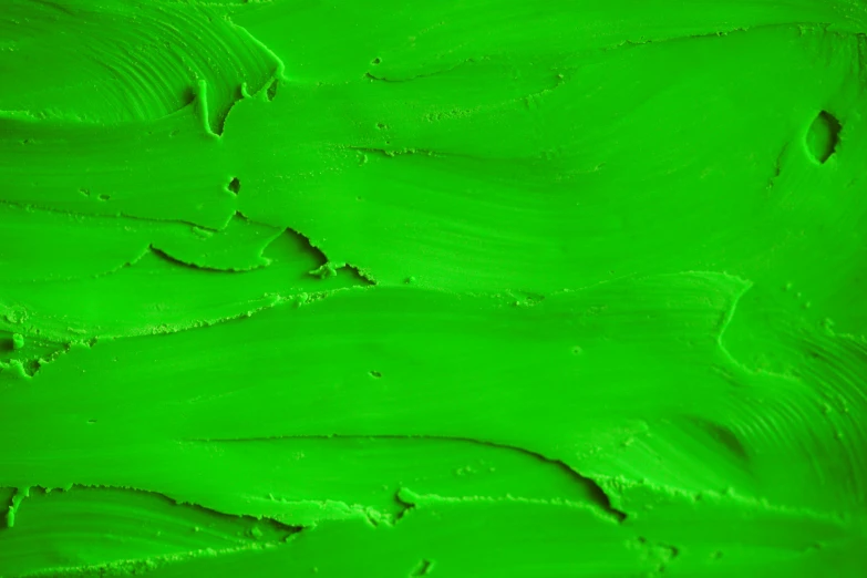 a close up of green paint on a wall, an album cover, inspired by Art Green, trending on pexels, neon green, thick impasto paint, smooth draw with oil painting, detailed product image