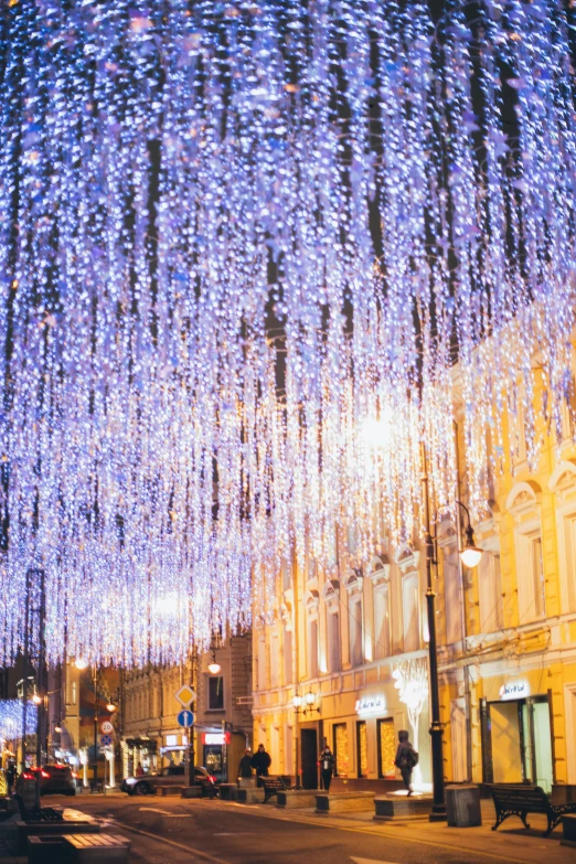 a bunch of lights hanging from the side of a building, street of moscow, glittering multiversal ornaments, lviv, rinko kawauchi