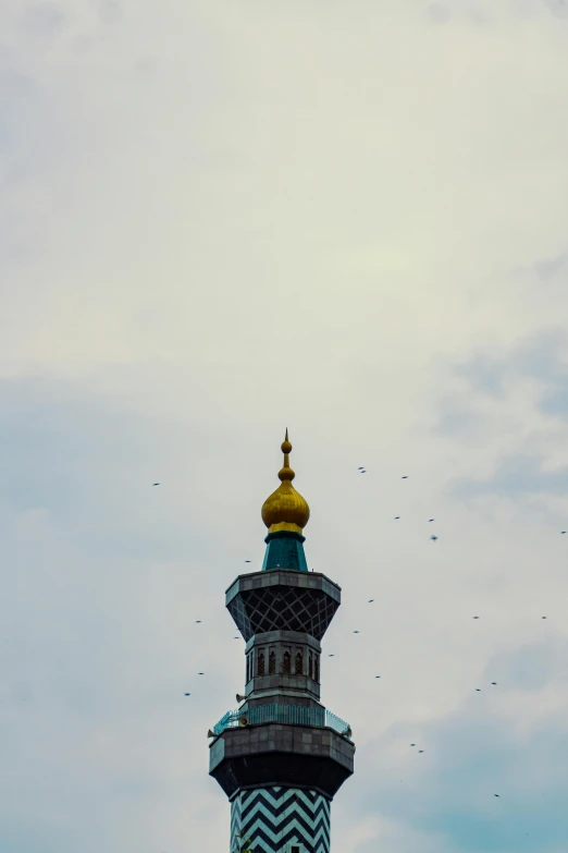 a tall tower with a clock on top of it, by Sven Erixson, trending on unsplash, baroque, ottoman sultan, flying birds in distance, saint petersburg, color photograph