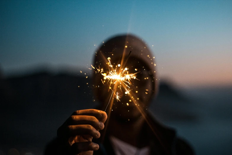 a person holding a sparkler in their hand, pexels contest winner, backlight, instagram post, profile image, frank moth