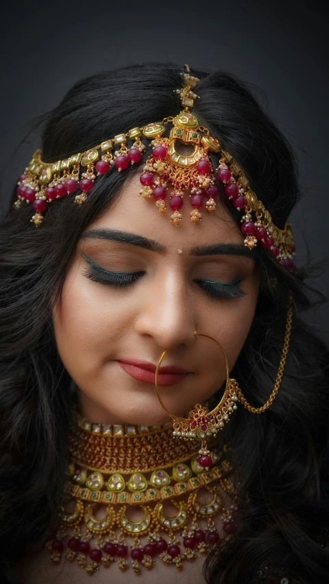 a woman with long black hair wearing a red and gold necklace, inspired by Saurabh Jethani, pexels contest winner, makeup, veils and jewels, 4 k asymmetrical portrait, a potrait of a beautiful