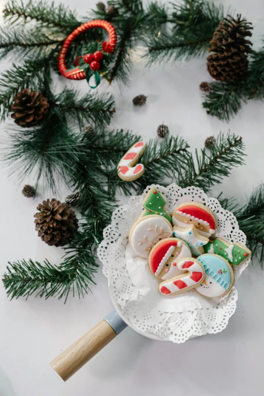 a white plate topped with cookies on top of a table, by Julia Pishtar, ornament, full product shot, bright, 1614572159