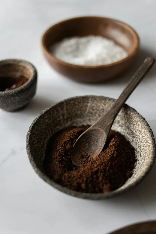 a close up of a bowl of food on a table, a still life, inspired by Ceferí Olivé, trending on unsplash, scales with magic powder, arabica style, dirt ground, detailed product image