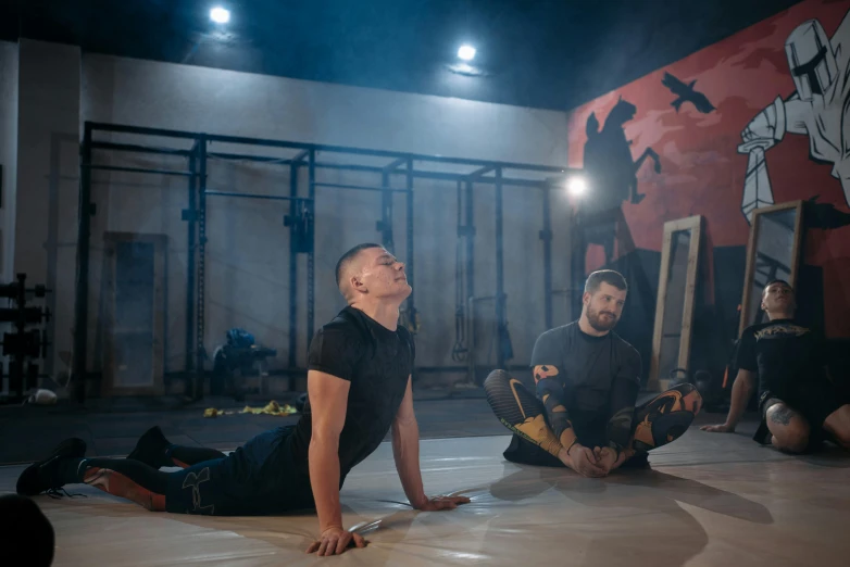 two men sitting on the ground in a gym, by Julia Pishtar, crucifixion of conor mcgregor, avatar image, [ theatrical ], ilya kushinov