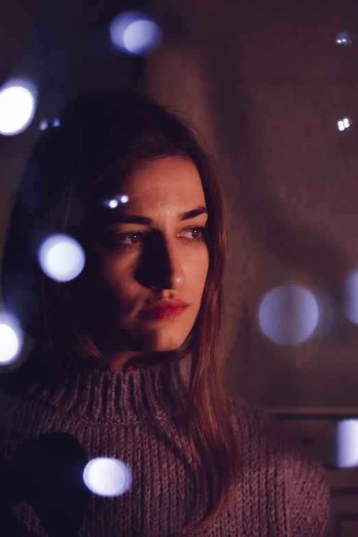 a close up of a person wearing a sweater, inspired by Elsa Bleda, pexels contest winner, rayonism light effects and bokeh, depressed girl portrait, handsome girl, holiday