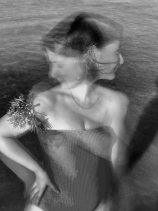 a black and white photo of a woman in a bathing suit, inspired by Peter Basch, surrealism, blurry and glitchy, bouquet, water fairy, ewa juszkiewicz