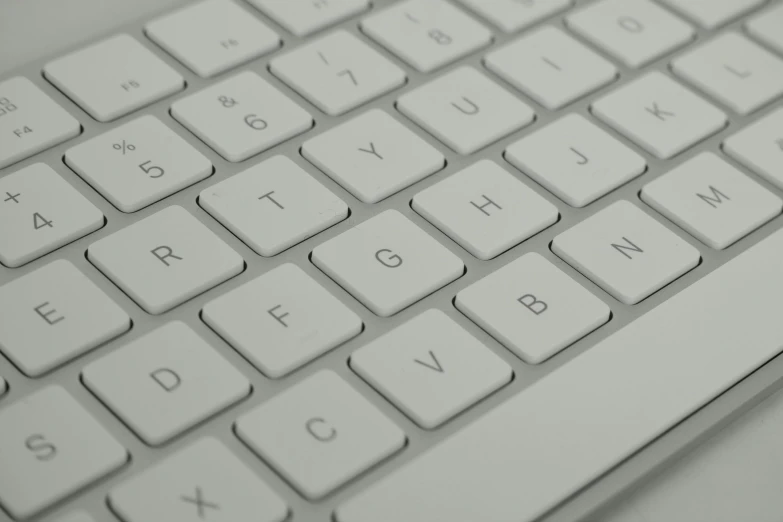 a close up of a keyboard on a table, an ambient occlusion render, by Jan Kupecký, soft white rubber, apple, pbr material, detail shot