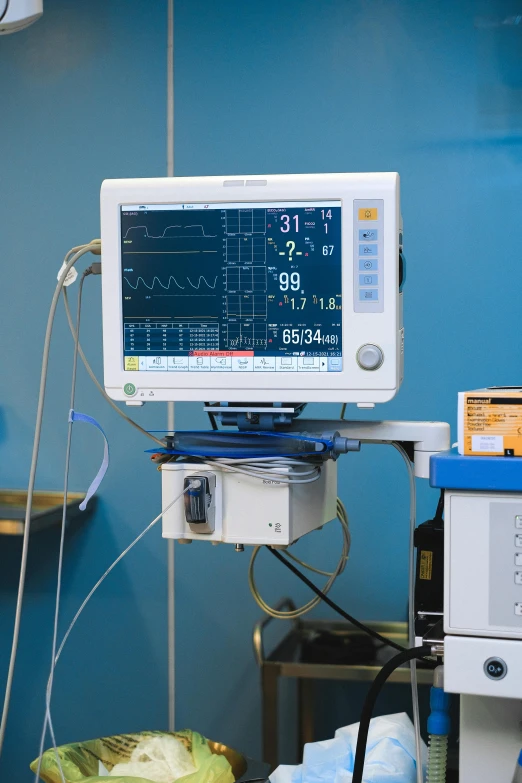 a hospital room with a monitor and other medical equipment, unsplash, with electric arc device, blue, gold, schools