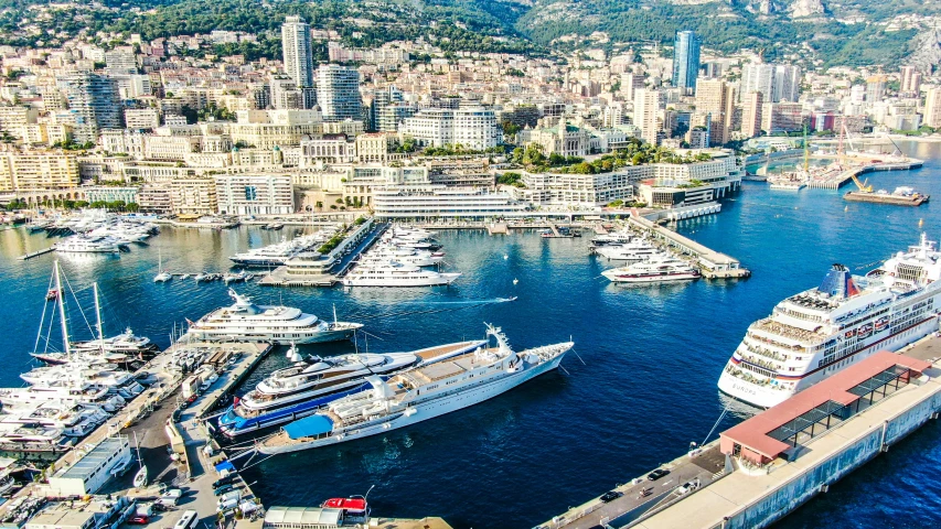 a harbor filled with lots of boats next to tall buildings, a photo, pexels contest winner, renaissance, on a super yacht, aerial footage, francois - edouard picot, full body in shot