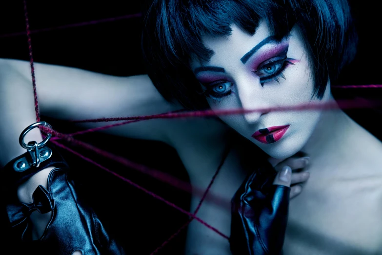 a close up of a person with makeup on, an album cover, featured on cgsociety, gothic art, shibari, deep colours. ”