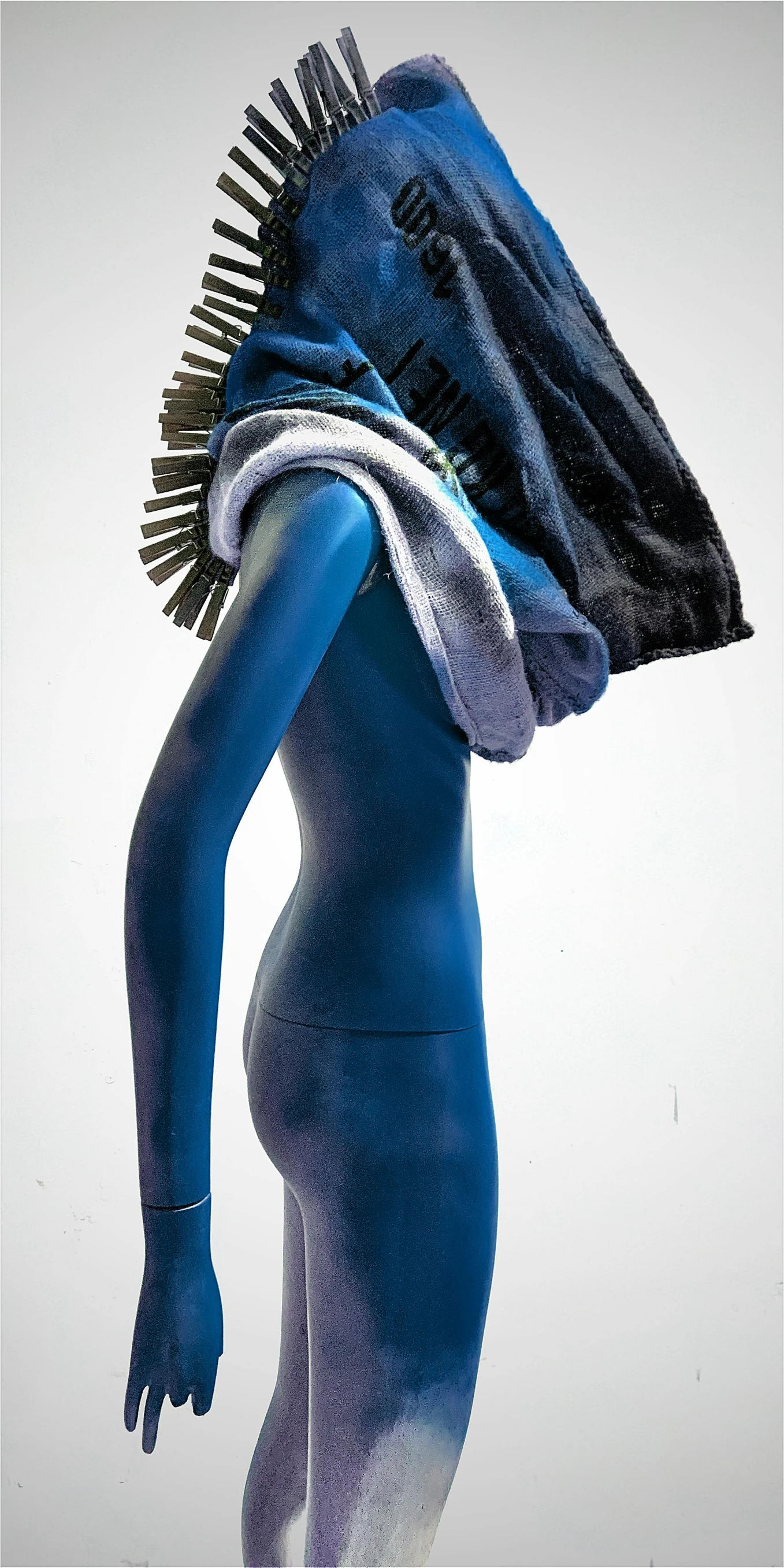 a close up of a person in a blue bodysuit, an abstract sculpture, inspired by Bert Stern, trending on zbrush central, wrapped in a black scarf, detailed product image, fur hdr, mannequin