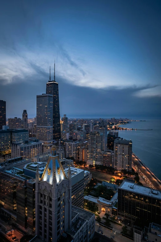 a view of a city from the top of a building, by Greg Rutkowski, pexels contest winner, renaissance, chicago skyline, 8k hdr dusk light, ocean view, tall spires