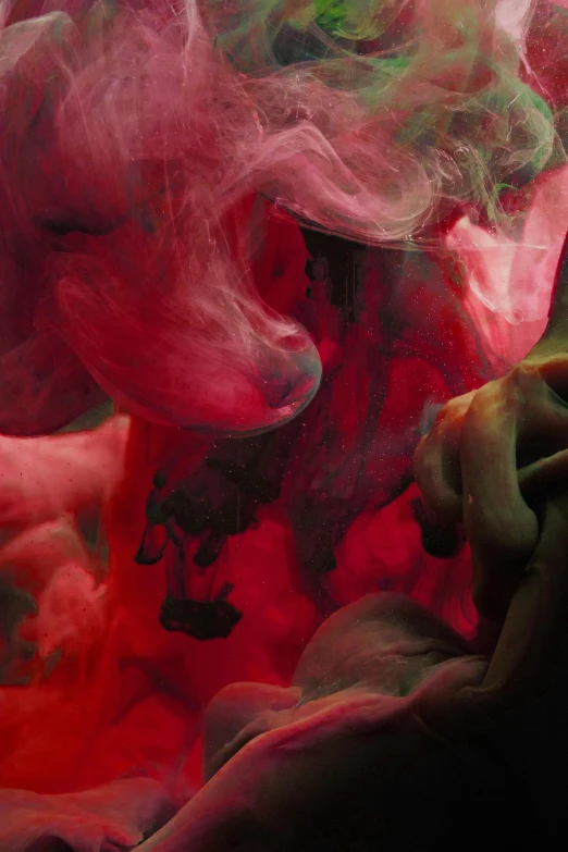 a close up of a person holding a cell phone, inspired by Kim Keever, pink smoke, alberto seveso and dan mccaw, red ink, underwater ink