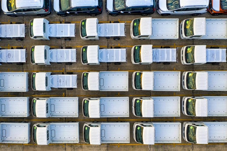 a parking lot filled with lots of parked cars, unsplash, van, knolling, worksafe. instagram photo, white