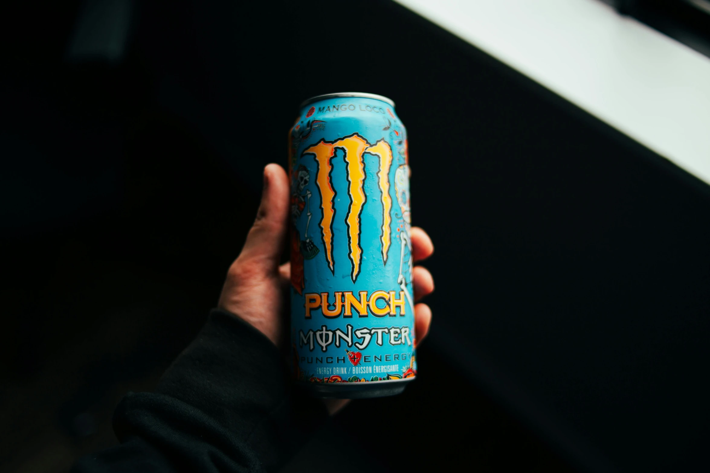 a person holding a can of monster energy, pexels contest winner, sucker punch, blueish, hungry, but monster is dendritic