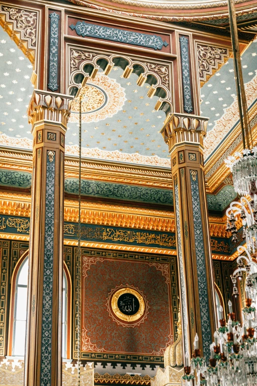 a chandelier hanging from the ceiling of a building, a detailed painting, inspired by Osman Hamdi Bey, trending on unsplash, baroque, green and gold palette, mosque interior, 2 5 6 x 2 5 6 pixels, tall columns