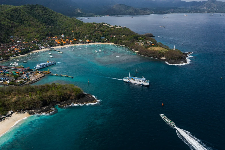 a large body of water next to a beach, by Daren Bader, pexels contest winner, sumatraism, ships in the harbor, coral reefs, peter hurley, thumbnail