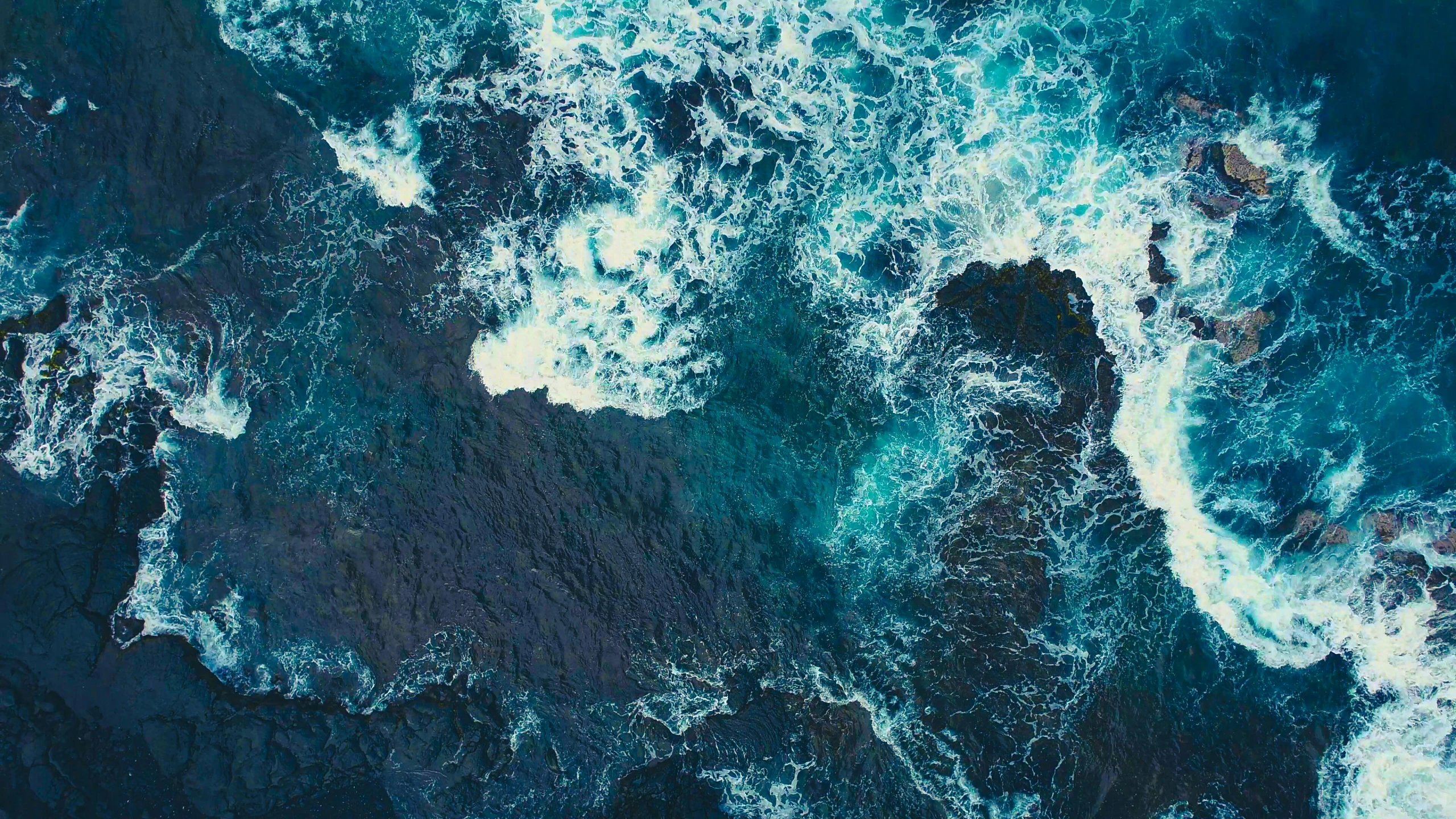 a view of the ocean from above, an album cover, pexels, process art, waves of energy, mariana trench, overflowing energy, movie