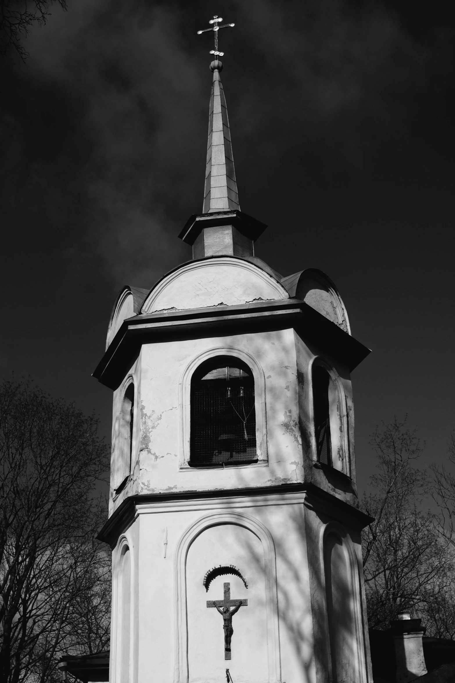 a black and white photo of a church steeple, a black and white photo, by Ihor Podolchak, square, solemn, 8k 50mm iso 10, anna podedworna