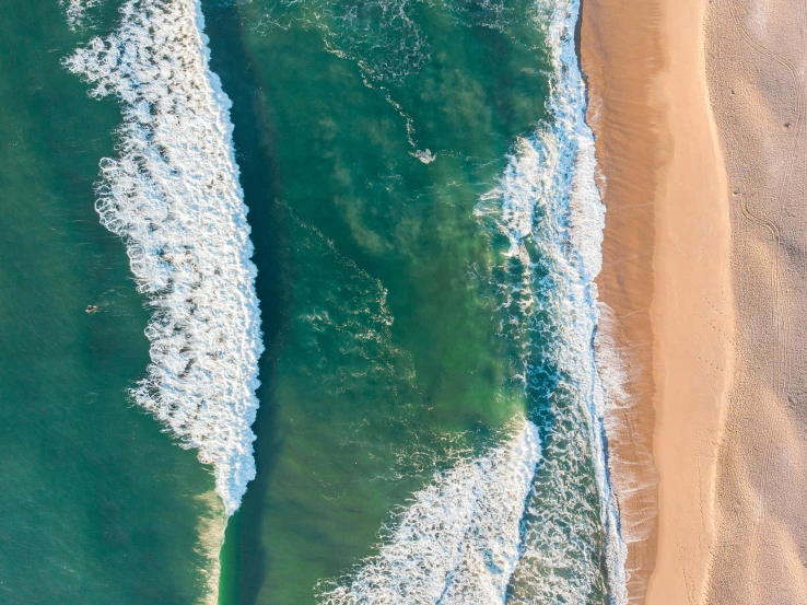 a large body of water next to a sandy beach, pexels contest winner, airborne view, thumbnail, pastelwave, 4k —height 1024 —width 1024