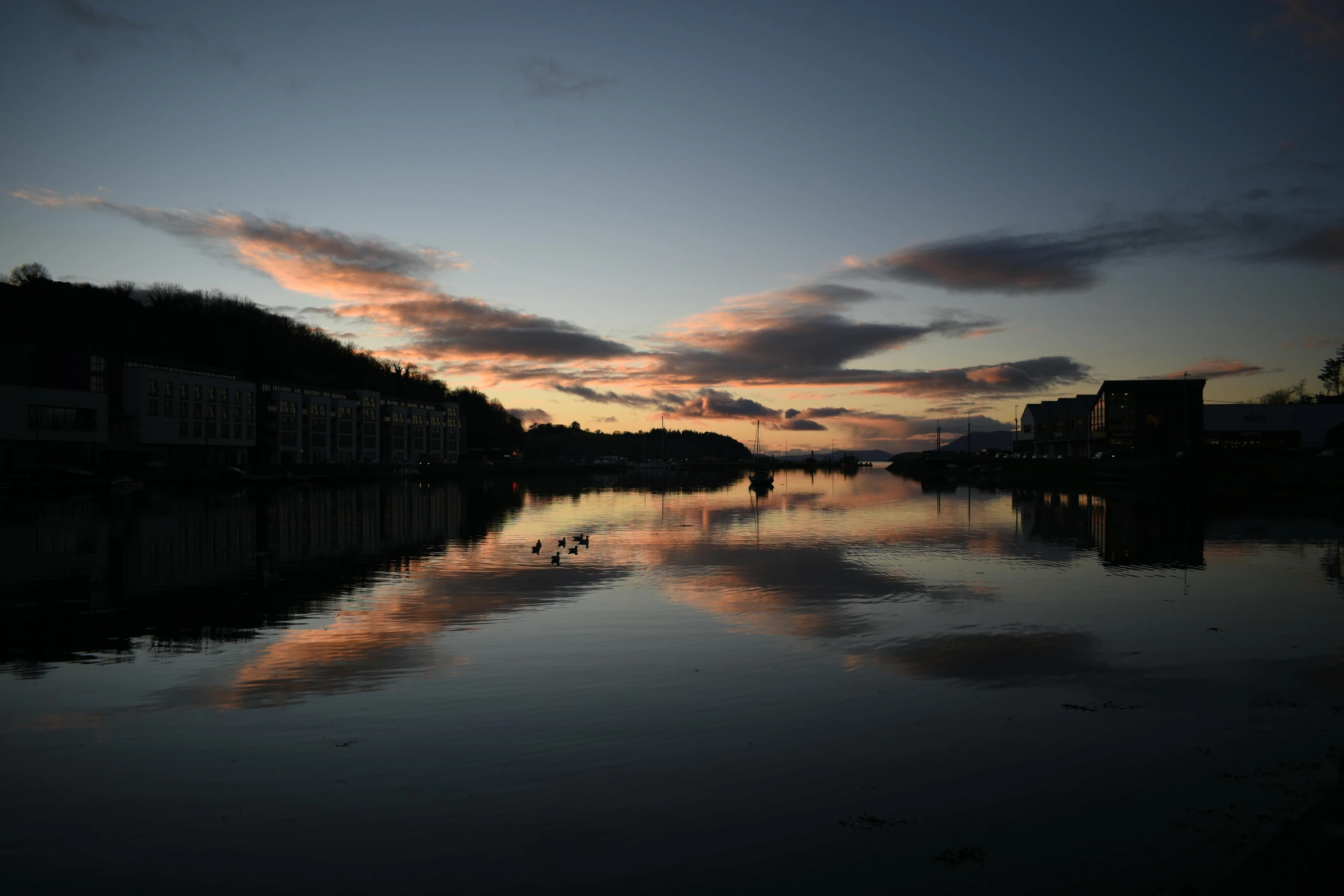 a body of water with a sunset in the background, by Tom Bonson, pexels contest winner, romanticism, victorian harbour night, surface reflections, hamar, thumbnail