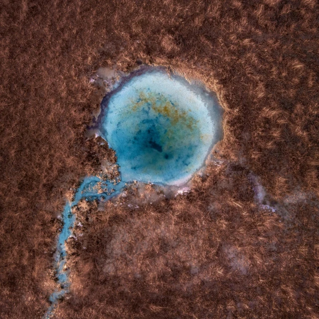 an aerial view of a blue hole in the ground, an ultrafine detailed painting, trending on unsplash, ((rust)), azamat khairov, opal, bird\'s eye view