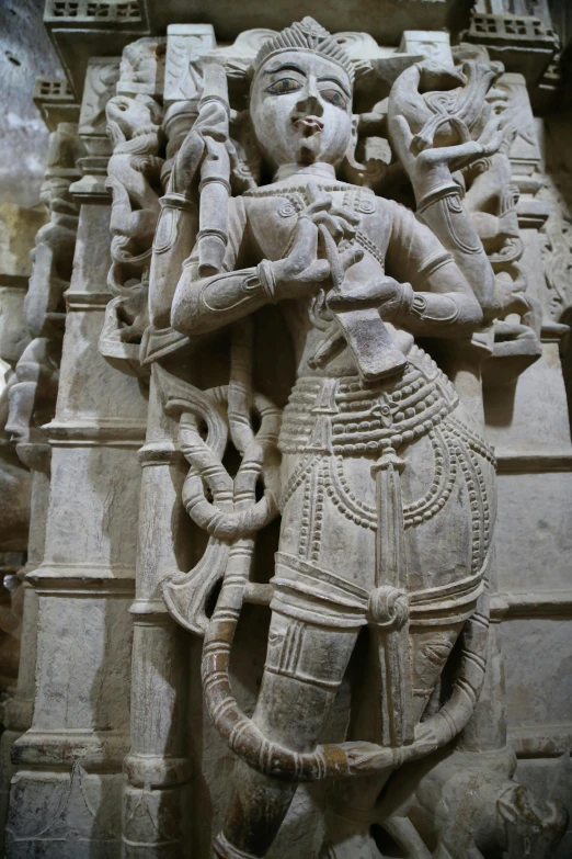 a statue of a woman holding a snake, a marble sculpture, inspired by Kailash Chandra Meher, romanesque, photogenic details on armor, holes in a religious man, detailed legs towering over you, 14th century