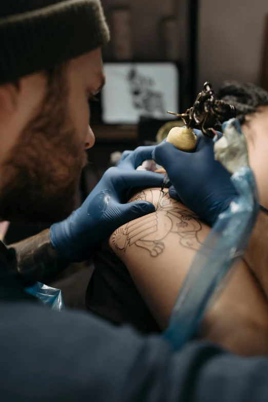 a man getting a tattoo on another man's arm, trending on pexels, hyperrealism, sailor jerry tattoo flash, blue, stitching, 2995599206
