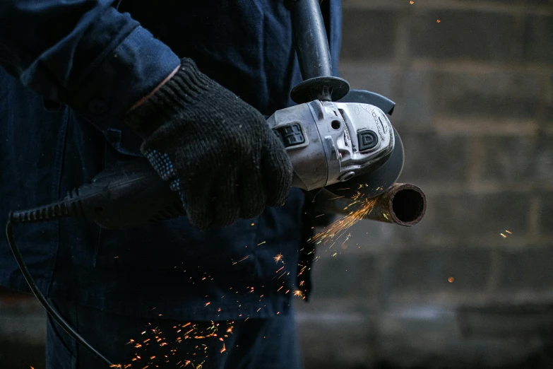 a close up of a person using a grinder, by Adriaen Hanneman, pexels contest winner, arbeitsrat für kunst, full body hero, profile image, thumbnail, chunky gauntlets