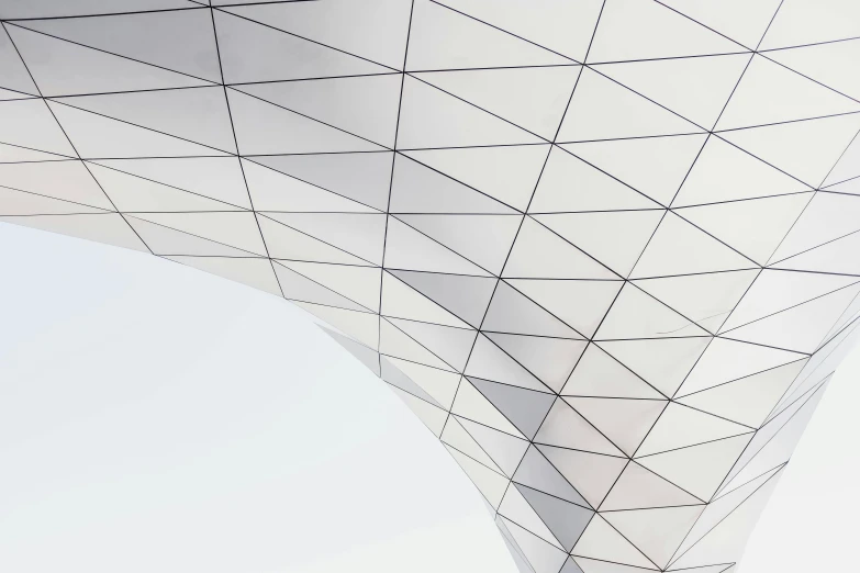 a man riding a skateboard up the side of a building, a picture, inspired by Zaha Hadid, unsplash contest winner, minimalism, geodesic dome, silver，ivory, detailed scales, glossy white metal