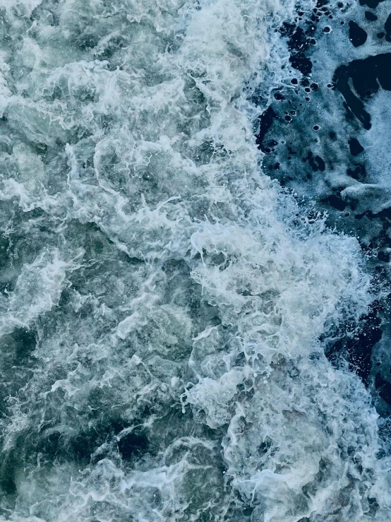 a man riding a surfboard on top of a wave, filled with water, photograph from above, river flowing through a wall, slightly pixelated