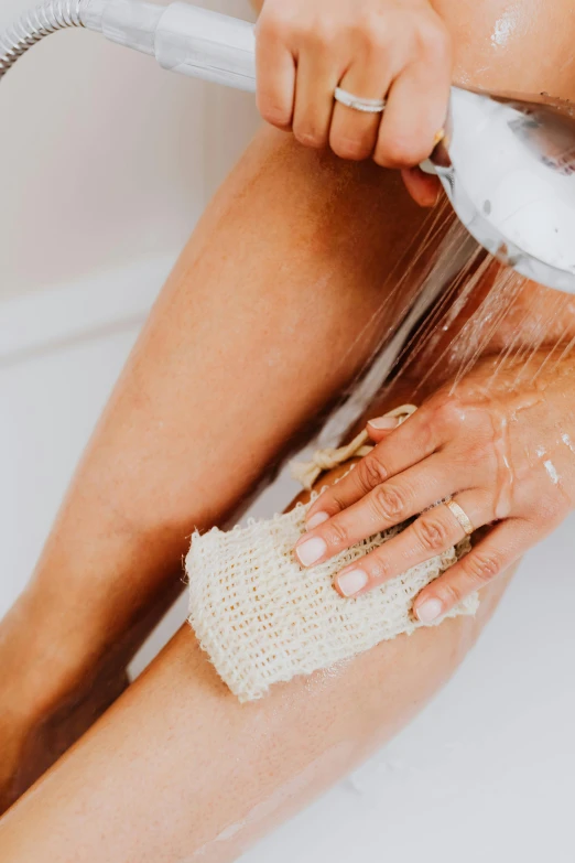 a woman washing her legs in a bathtub, unsplash, renaissance, made of lab tissue, crochet skin, manuka, with textured hair and skin