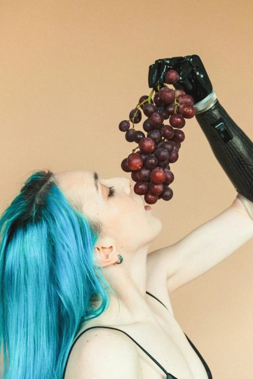 a woman with blue hair holding a bottle of wine and a bunch of grapes, inspired by Elsa Bleda, unsplash, aestheticism, robotic prosthetic arm, latex domme, singularity sculpted �ー etsy, amouranth