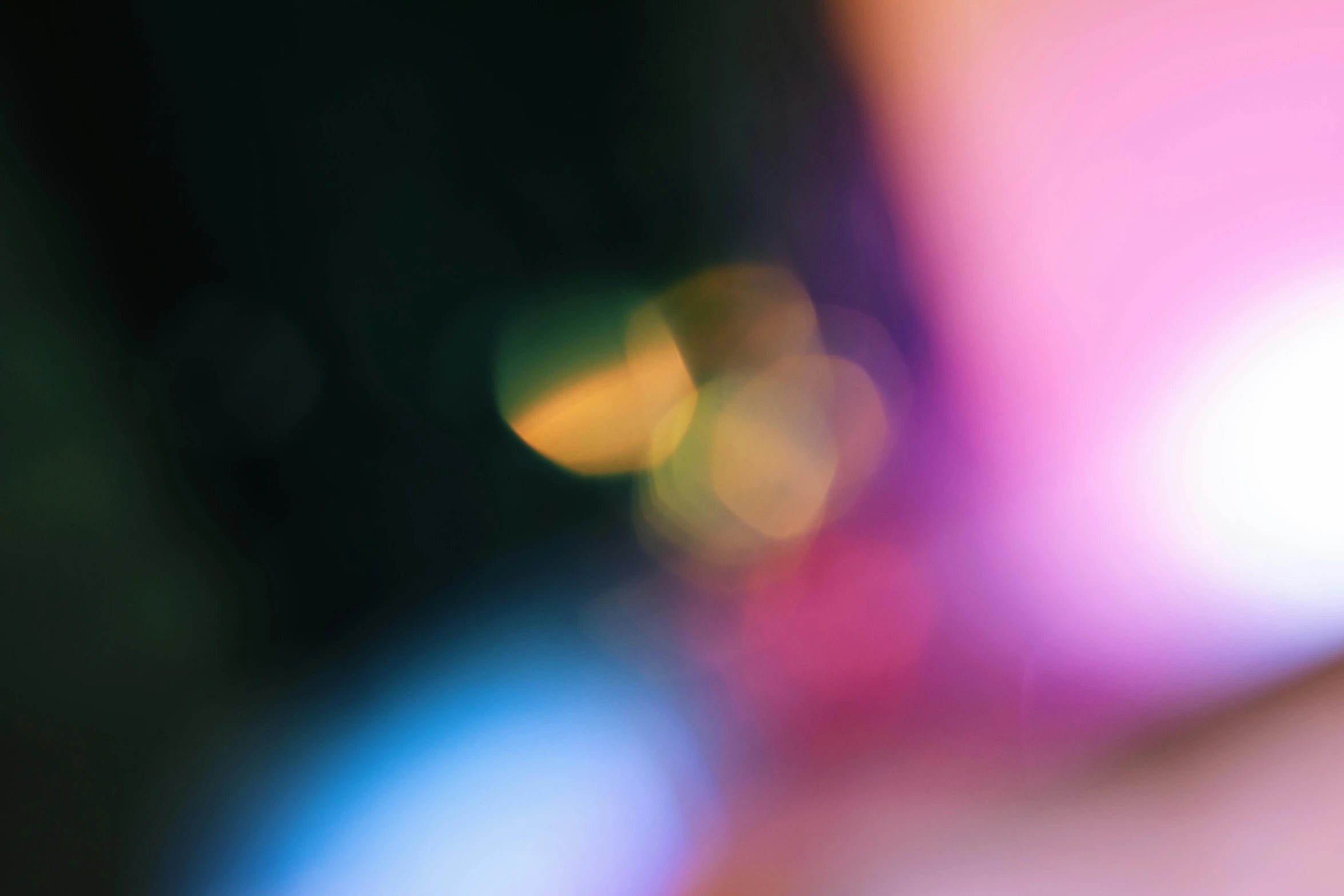 a close up of a cell phone with a blurry background, by Jan Rustem, unsplash, light and space, multicoloured, abstracted, night color, hasselblad film bokeh