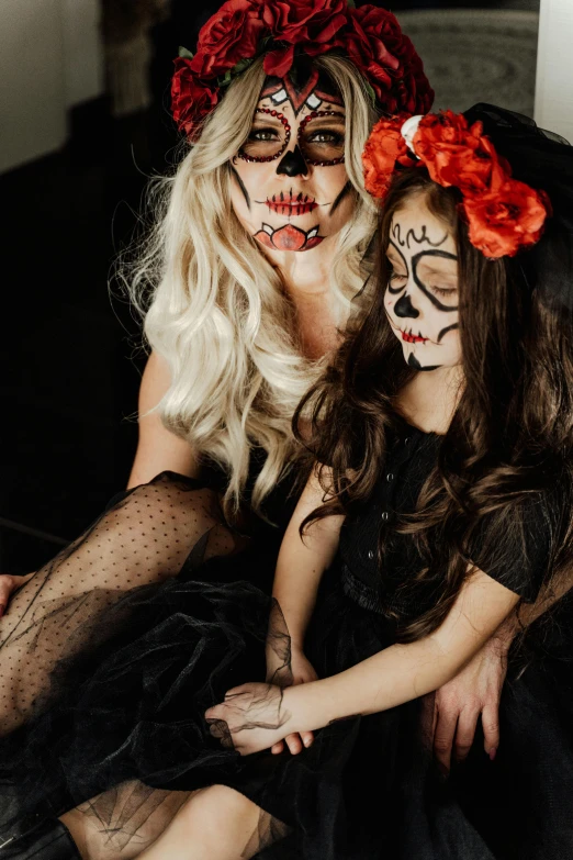 a couple of women sitting next to each other, a portrait, by Briana Mora, trending on pexels, vanitas, halloween celebration, daughter, full view of face and body, 15081959 21121991 01012000 4k