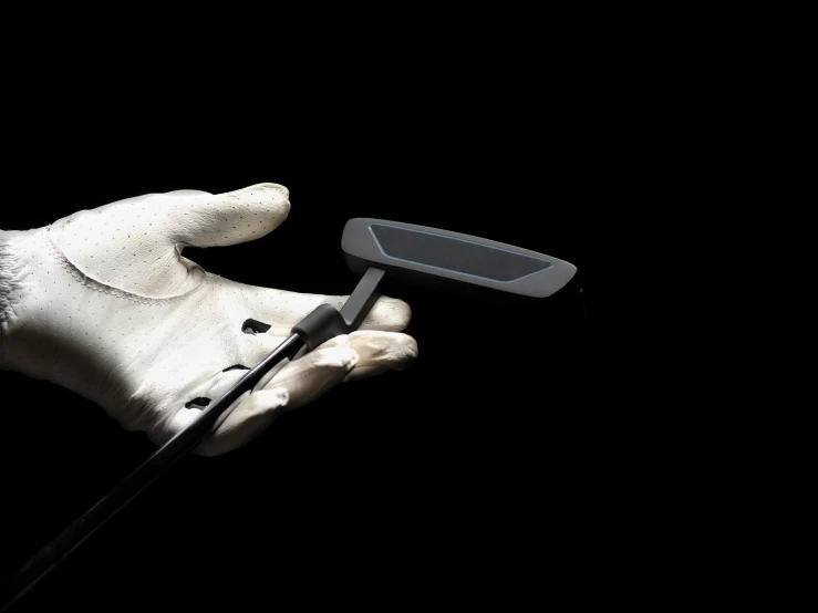 a gloved hand holding a pair of scissors, a digital rendering, inspired by Luis Molinari, unsplash, black 3 d cuboid device, clubs, off - putting, with a sleek spoiler