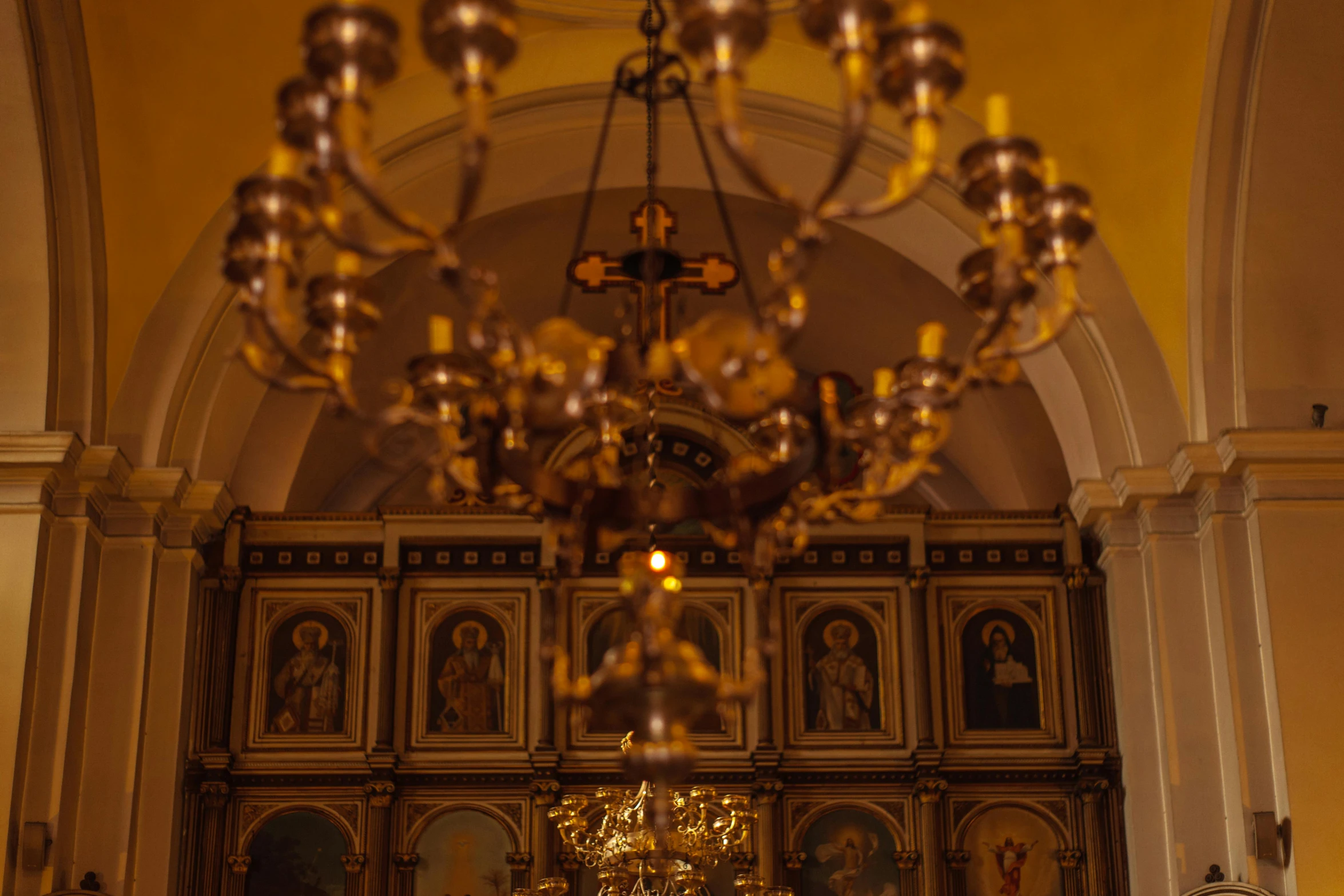 a chandelier hanging from the ceiling of a church, pexels, baroque, orthodox icons, square, cinematic still, brown and gold color palette