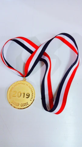 a gold medal with a red, white and blue ribbon, pexels contest winner, hurufiyya, made in 2019, - 9, gold plated, n 9