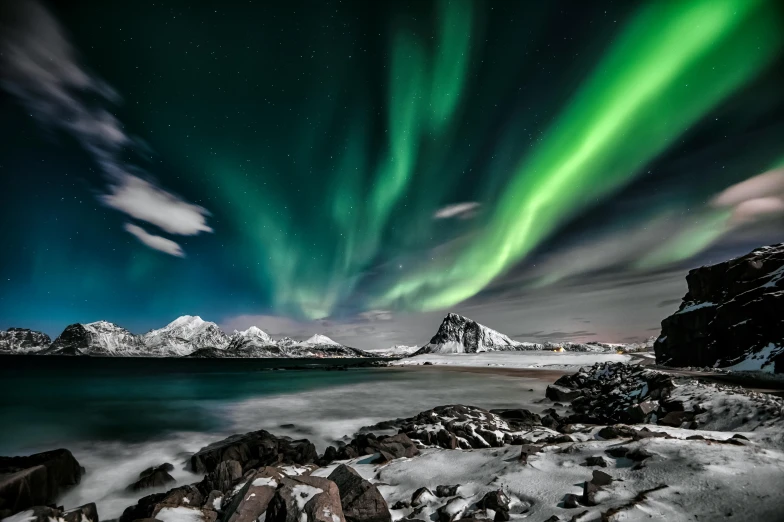 the aurora lights in the sky over a body of water, pexels contest winner, icy mountains in the background, coastal, hasselblad photography, panels