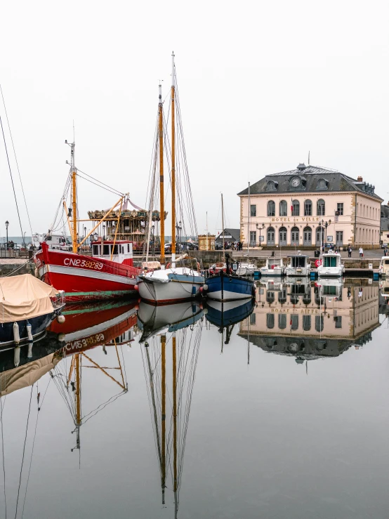 a number of boats in a body of water, by Sebastian Spreng, pexels contest winner, art nouveau, wet reflections in square eyes, detmold, high resolution photograph, 2022 photograph