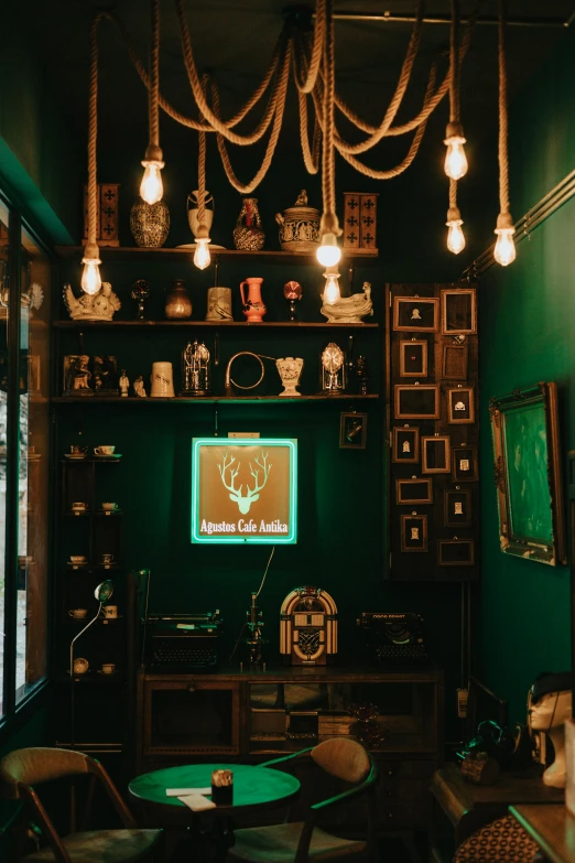 a room that has a table and chairs in it, trending on pexels, maximalism, green scary lights, a steampunk store, ( ( dark green, shrine
