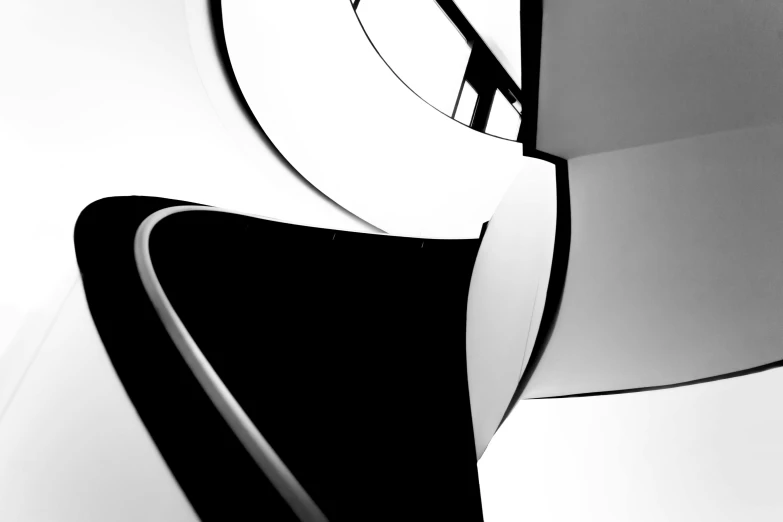 a black and white photo of a spiral staircase, an abstract sculpture, inspired by Zaha Hadid, unsplash, ((raytracing)), abstract mirrors, monochrome:-2, white and black