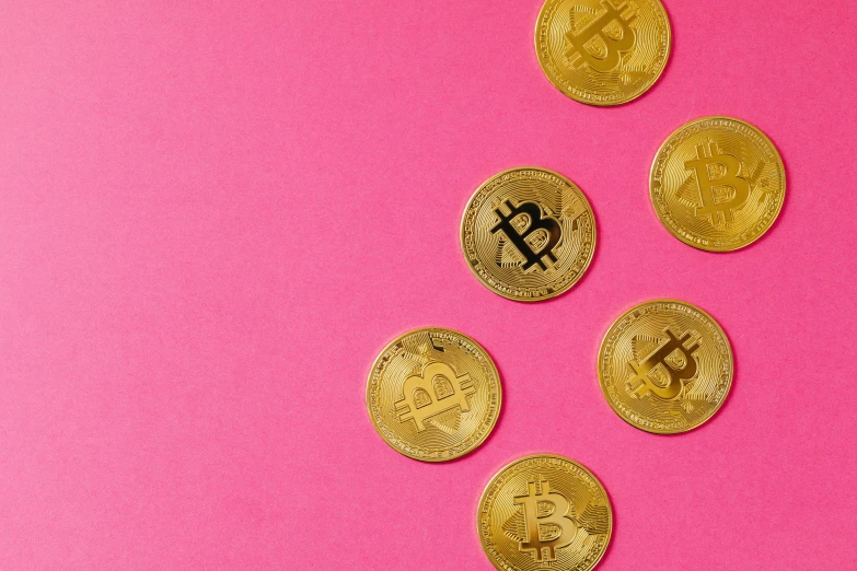 a bunch of gold bitcoins on a pink background, a screenshot, by Carey Morris, trending on pexels, adafruit, brown, magenta, 8