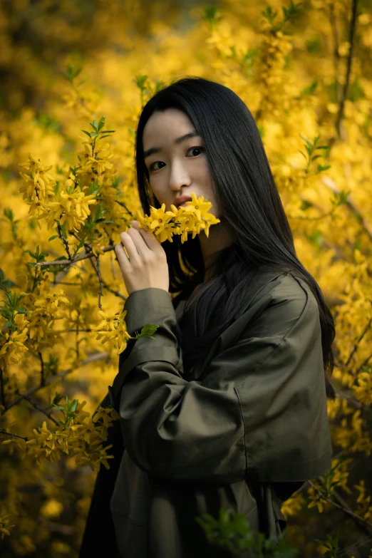 a woman standing in a field of yellow flowers, inspired by Yang J, pexels contest winner, portrait of a japanese teen, paul barson, ethnicity : japanese, female with long black hair