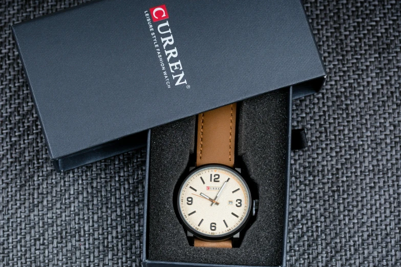 a close up of a watch in a box, inspired by Eugène Brands, reddit, light brown, qirex, detailed product image, various posed