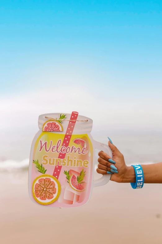 a person holding a sign that says welcome summer, poster art, shutterstock contest winner, glass jar, in a beachfront environment, a full-color airbrushed, iced tea glass