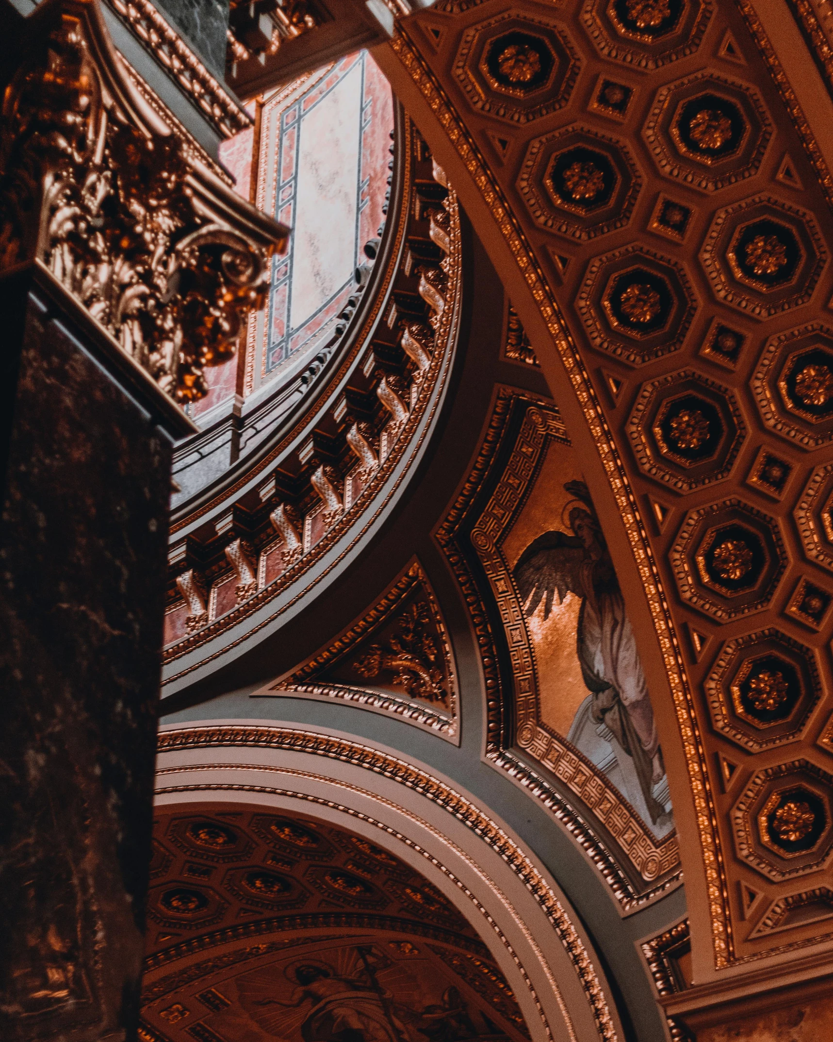 a clock hanging from the ceiling of a building, inspired by Christopher Wren, unsplash contest winner, with great domes and arches, brown and gold color palette, gothic library, instagram post